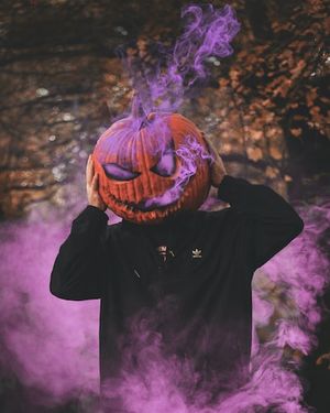 man wearing jack-o-lantern